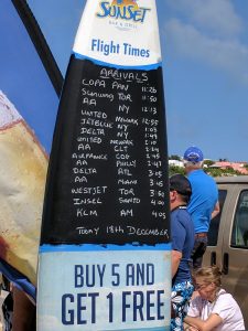 Arrival times for major airlines are posted on the beach.